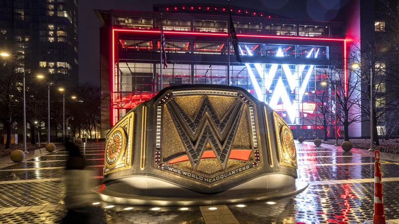 A WWE logo shines from the WWE wrestling world headquarters on January 28, 2024 in Stamford, Connecticut. WWE founder Vince McMahon resigned from the WWE and its parent company TKO as executive chairman and board of directors following allegations of sexual assault in a Connecticut lawsuit. A former employee Janel Grant accused McMahon, 78, of sexual assault and sexually trafficking her.