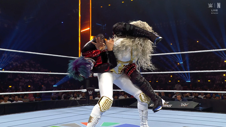 Asuka with a submission locked in on Cargill