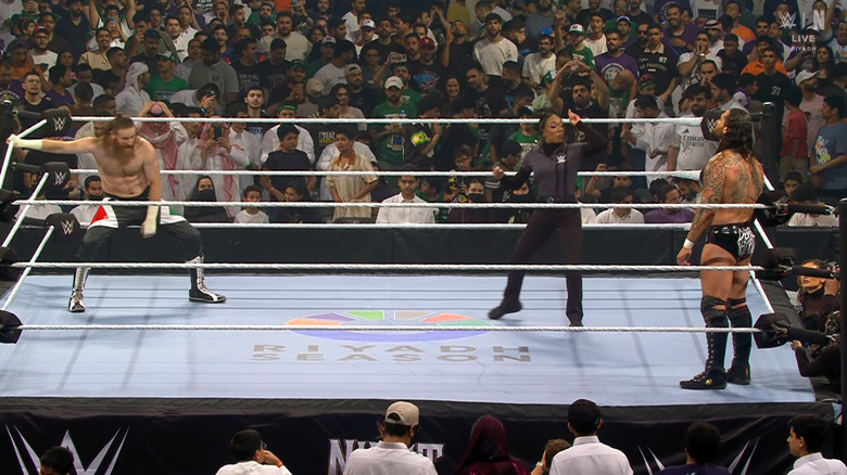 Zayn and Kross staring down one another in the ring