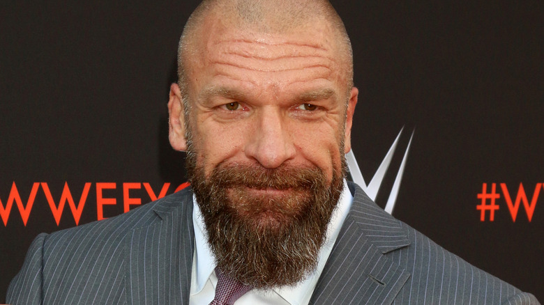 Triple H posing