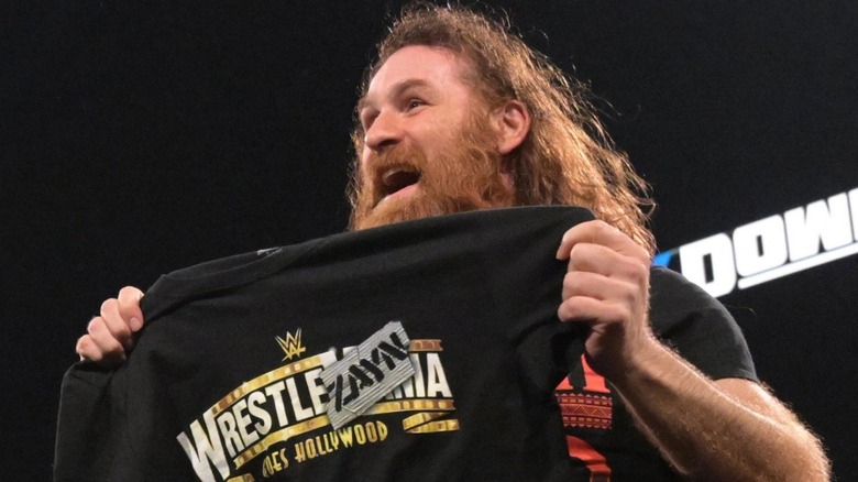 Sami Zayn showing off his new shirt