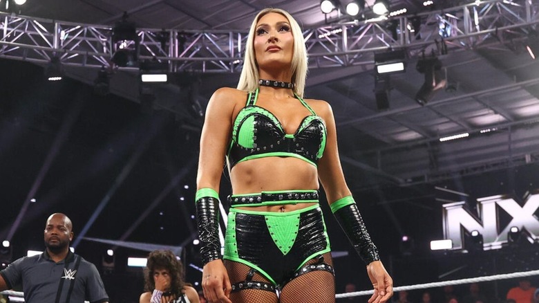 Izzi Dame stands in the ring and looks up the ramp to her opponent before a match on "WWE NXT."