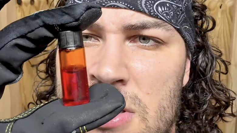 Shiloh Hill analyzes a vial of mist