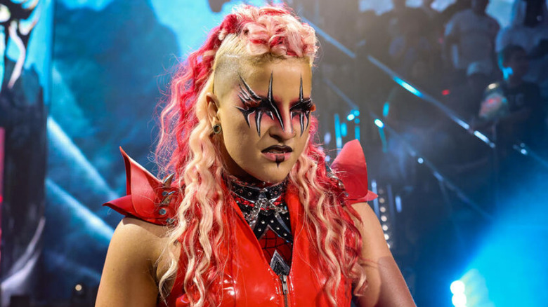 Zaria wearing a red ring jacket