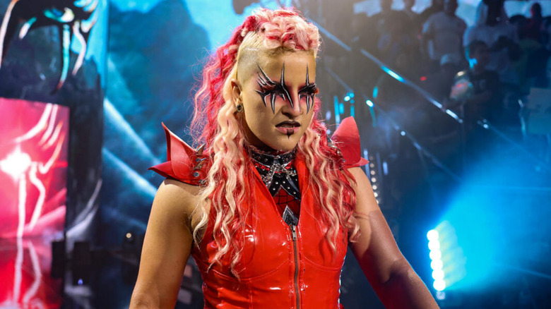 Zaria wearing a red ring jacket
