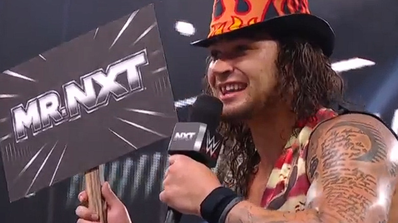 Shiloh Hill holding up a "Mr. NXT" sign