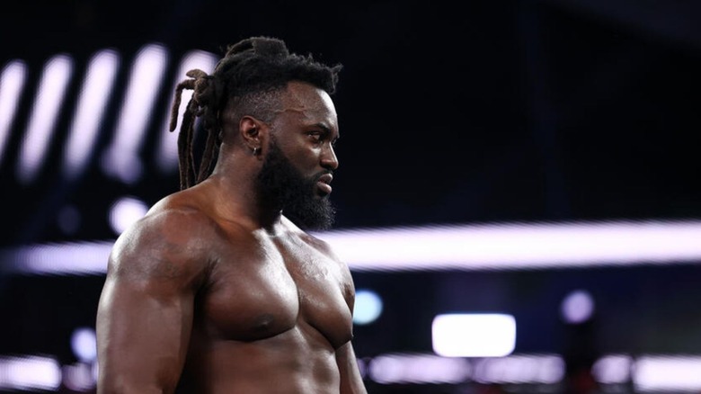 Keanu Carver stares off into the distance in the ring ahead of a match on WWE programming.