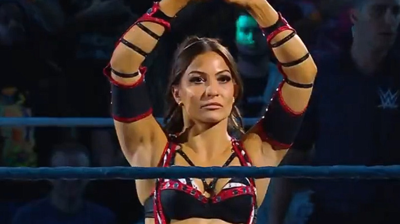Kendal Grey raising her arms