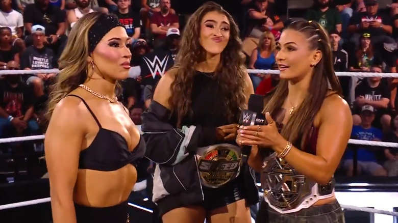 Kendal Grey talking to Lola Vice in a WWE ring