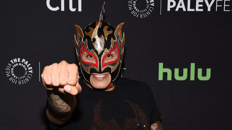 Rey Fenix holding out his fist