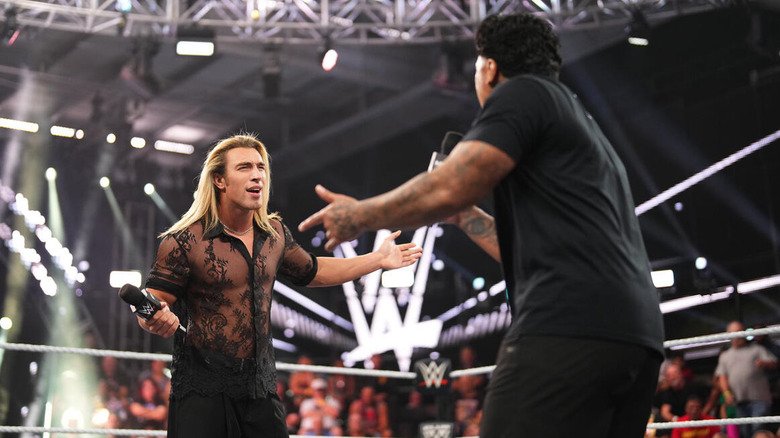 Angels and Zilla in the ring during their opening verbal confrontation on "WWE NXT"