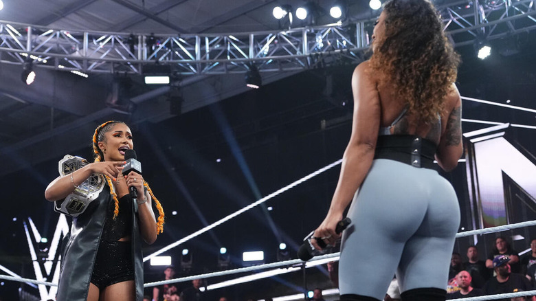 Kelani Jordan speaking to Jaida Parker on the microphone on "WWE NXT"