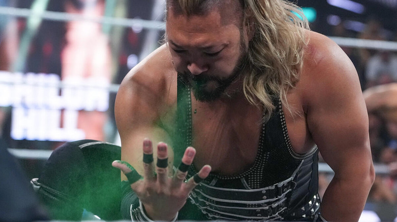 Naraku spits green mist onto his own hand in the ring on "WWE NXT"