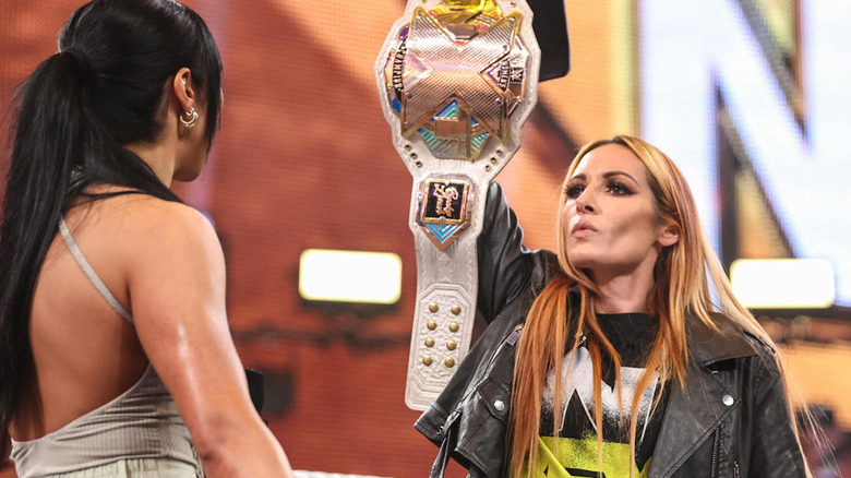 Becky Lynch holds up title belt