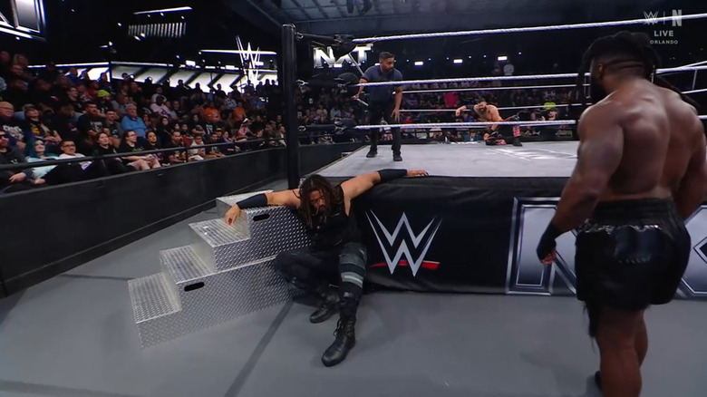 Troy adn Carver on the outside with Briggs still in the ring