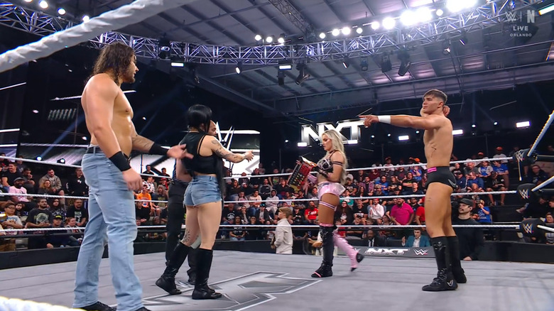 Hill, Paxley, Drake, and Monroe all in the ring talking to one aother