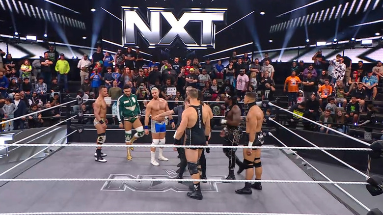 All eight men in the ring