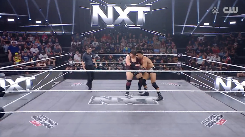 Rook and Hendrix in the middle of the ring