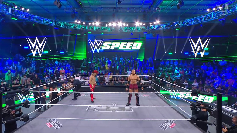 King and Price staring down one another inside the ring