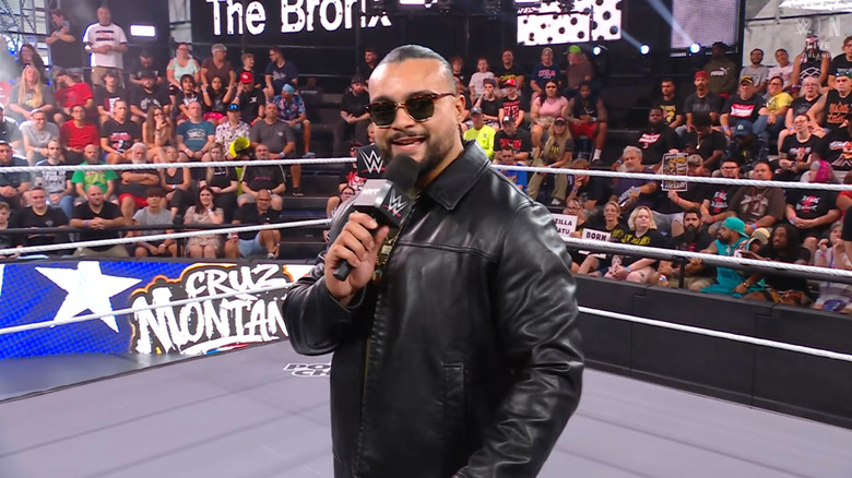 Montana smiling and speaking in the ring