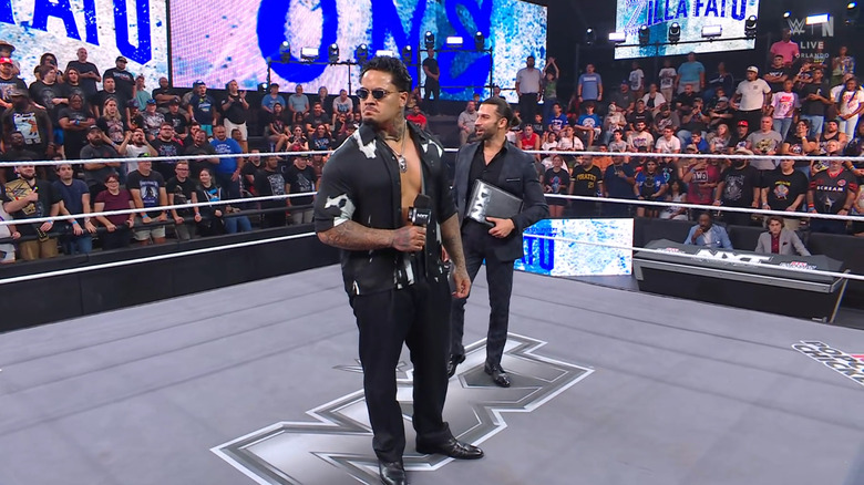 Zilla in the ring with Stone standing behind him