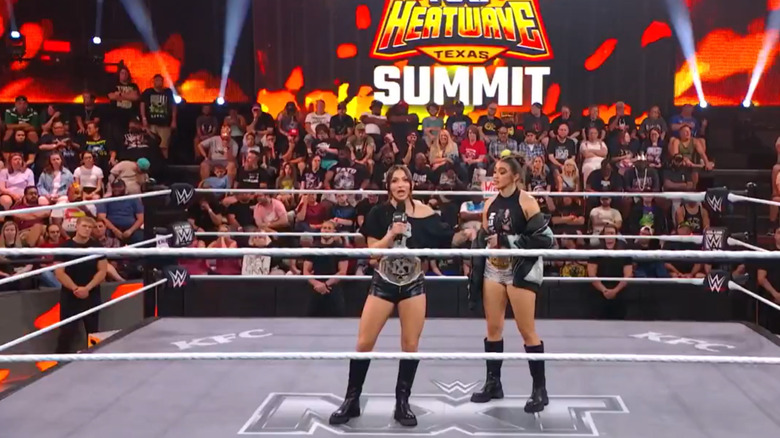 Kendal Grey and Wren Sinclair talk in the ring