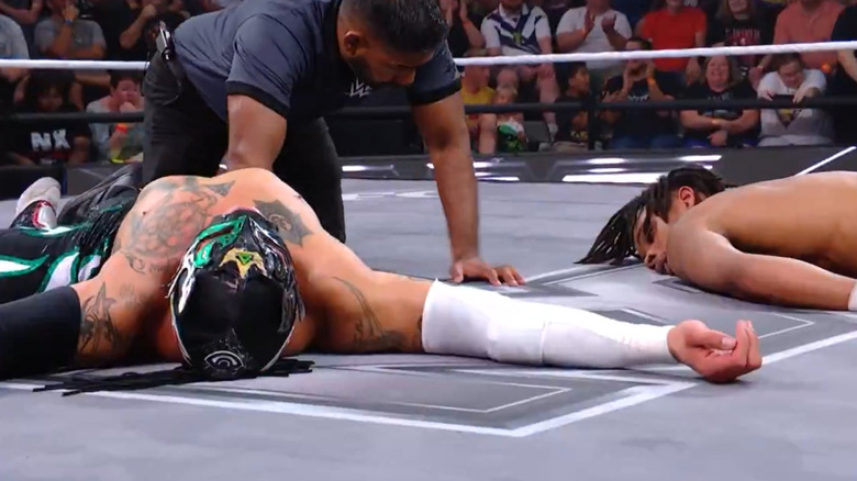 Rey Fenix and EK Prosper laid out in the ring