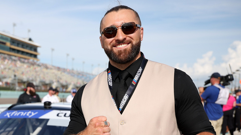 WWE NXT star, Tony D'Angelo poses with the #00 NXT on CW Ford, driven by Cole Custer on the grid prior to the NASCAR Xfinity Series Credit One NASCAR Amex Credit 300 at Homestead-Miami Speedway on October 26, 2024 in Homestead, Florida.