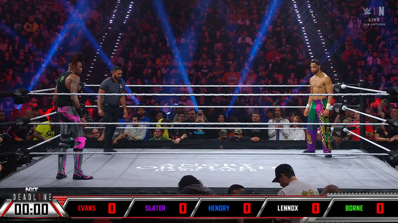 Evans and Slater staring one another down from opposite corners of the ring