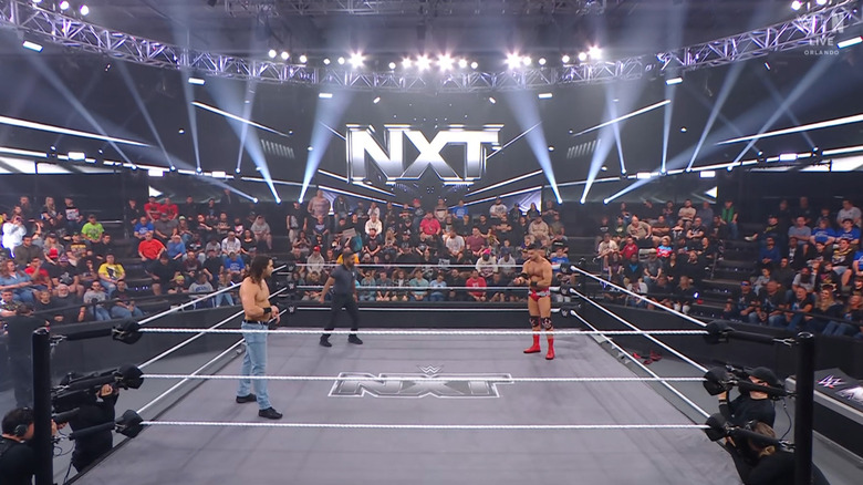 Hill and Page staring one another down in th ering