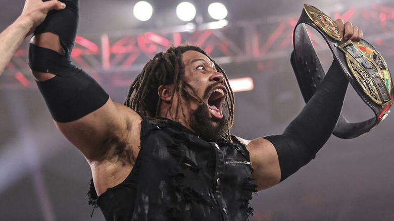 Troy holding up his Speed Championship belt