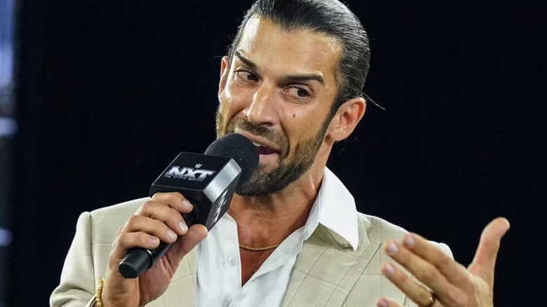 Robert Stone holding a microphone