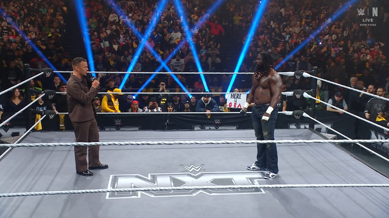 Saints and Femi speaking in the ring