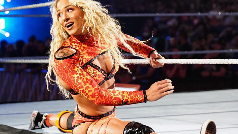 Sol Ruca hits the splits on the ring's apron during her entrance.