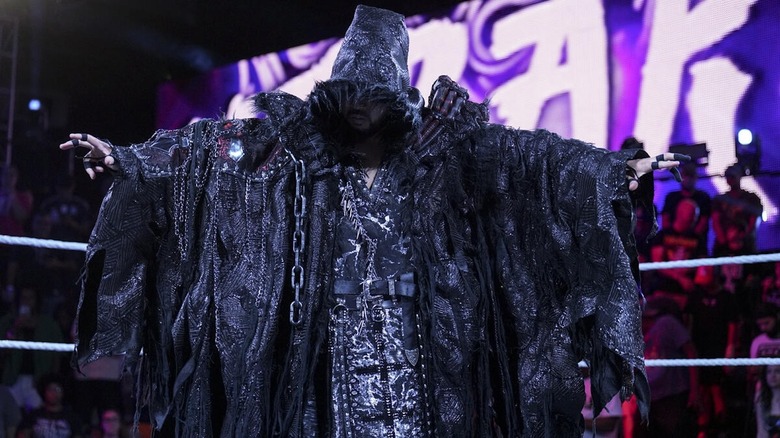 Naraku poses during his entrance on "WWE NXT"
