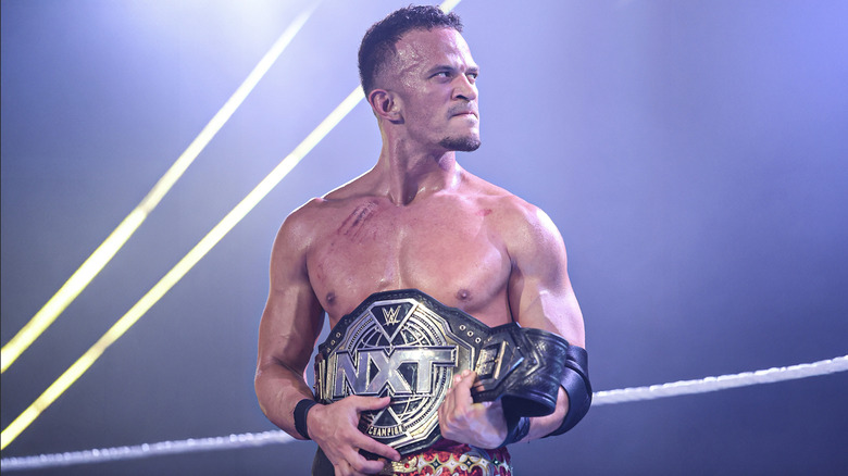 Saints with his NXT Championship belt