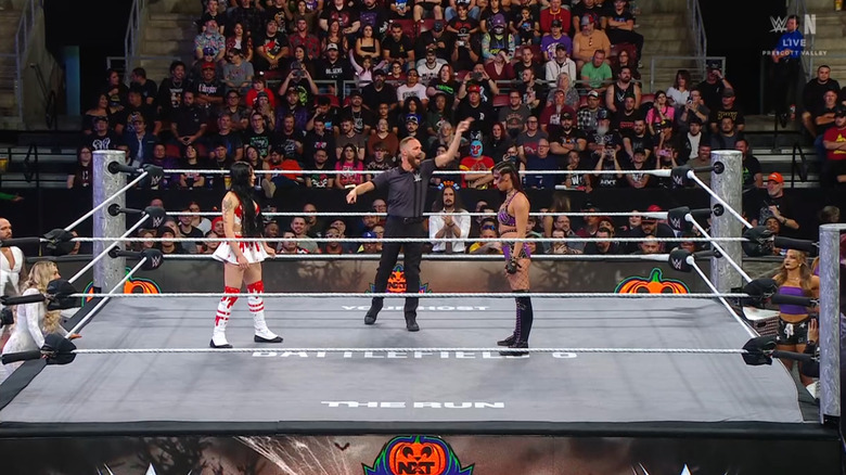 Paxley and Jayne staring one another down in the ring