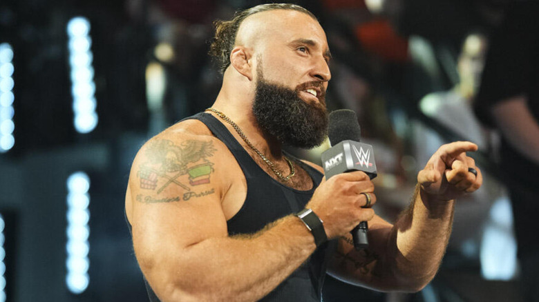 Tony D'Angelo holding a microphone