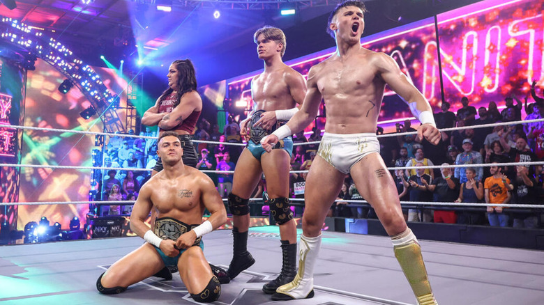 Myka Lockwood, Ricky Smokes, Brad Baylor, and Jackson Drake standing in the "WWE NXT" ring