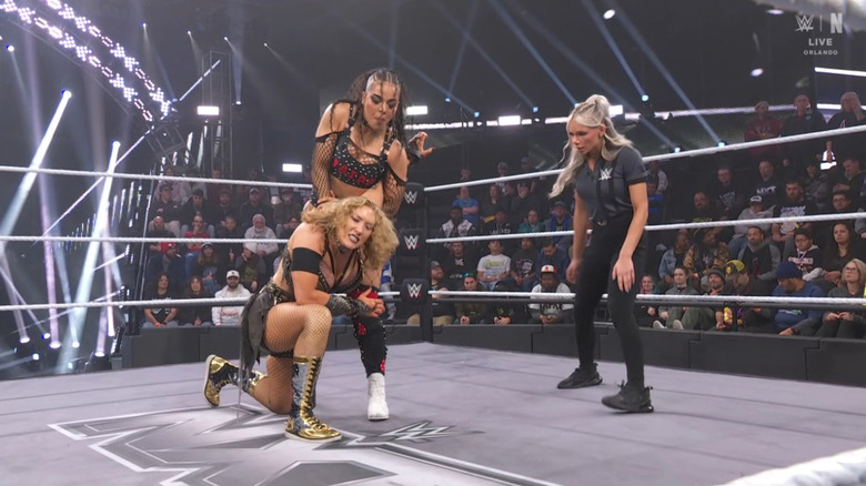 Parker with Lyons in a submission hold