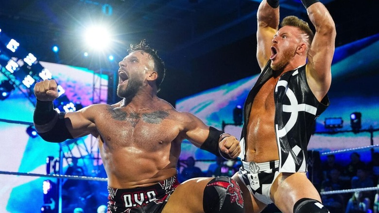 Dorian Van Dux and Sean Legacy pose in the ring before a tag team match on "WWE NXT."