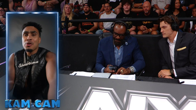 Booker T and Vic Joseph looking at Kam Hendrix via video call