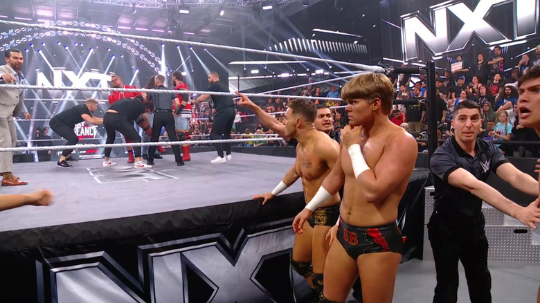 All six men at ringside after being pulled apart