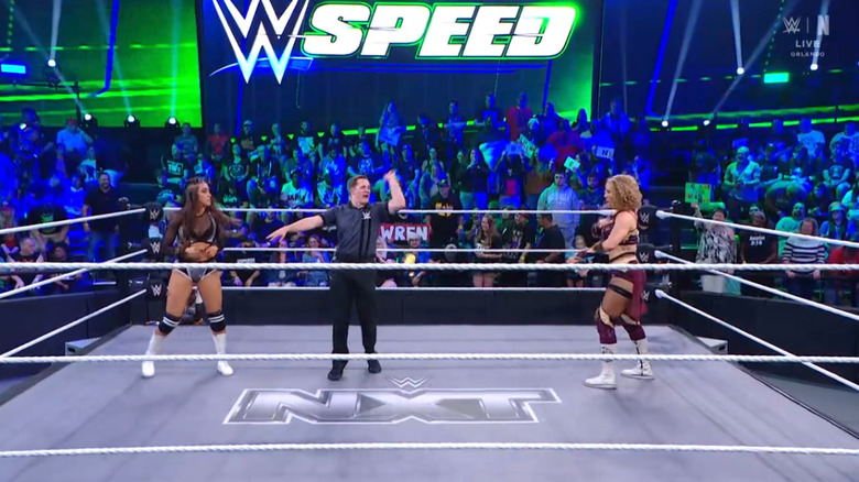 Sinclair and Lyons staring one another down