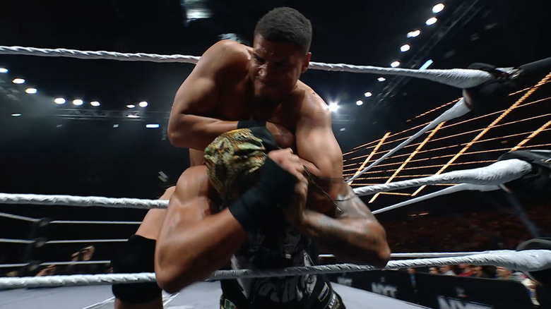 Dion Lennox pins Bronco Nima to the ropes.