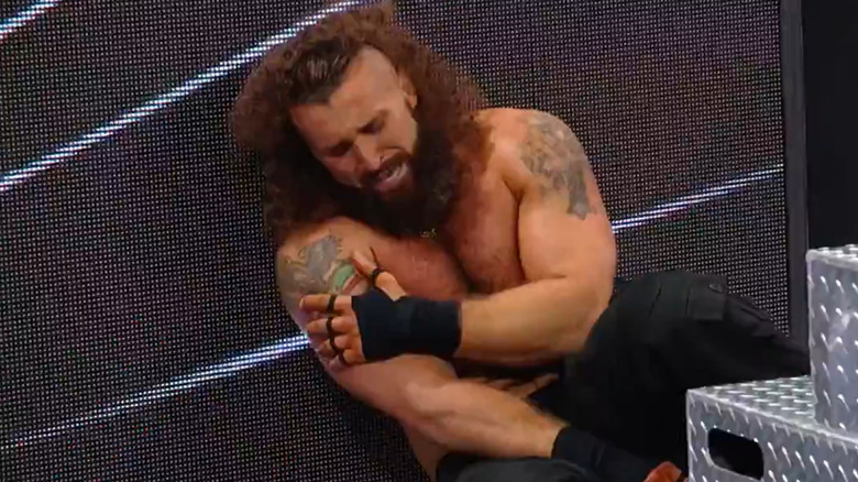 Tony D'Angelo sat at ringside