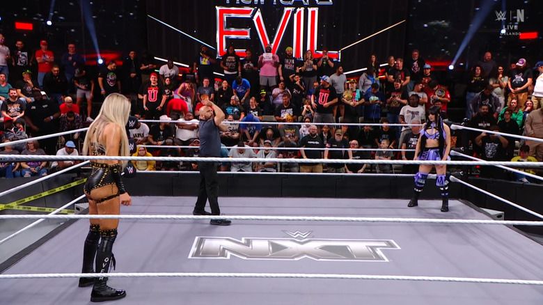 Dame and Paxley staring one another down