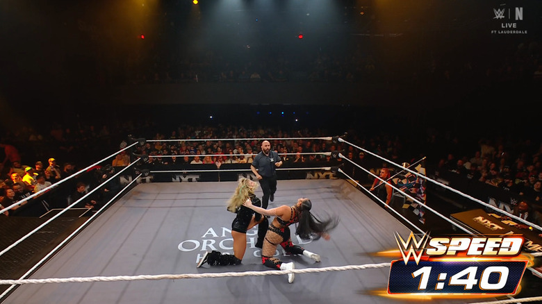 Ruca and Parker brawling in the ring