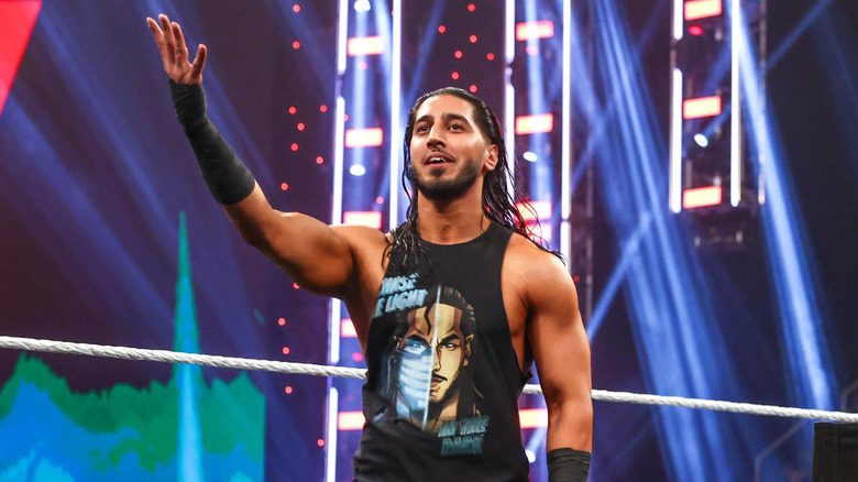 Mustafa Ali raising his right arm