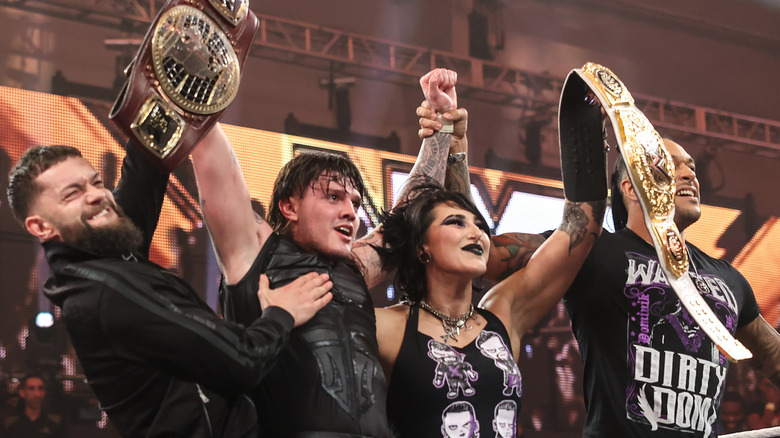 Dom Dom celebrates his North American Title win with the rest of Judgement Day